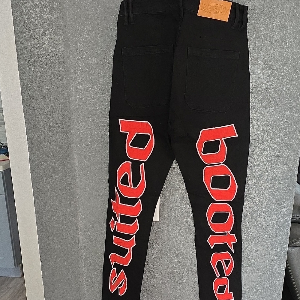 Bold Red and Black Skinny Jeans with Striking Text